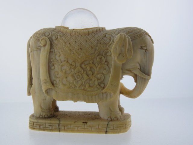 Old Indian Expertly Carved in the Round Ivory Elephant: Old Indian Expertly Carved in the Round Ivory Elephant Glass Crystal Globe Ball Stanhope on Key Motif Plinth Artfully carved with attached base from a single piece of ivory carved in the round. This u