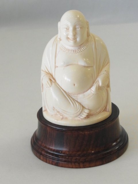 Antique Ivory Chinese Carved Seated Laughing Budai Budd: Small Antique Ivory Chinese Carved Seated Laughing Budai Buddha Maitreya Sculpture Statue on Wood Plinth Base Has expertly, delicately carved facial features, excellent craftsmanship. Approximate Dime