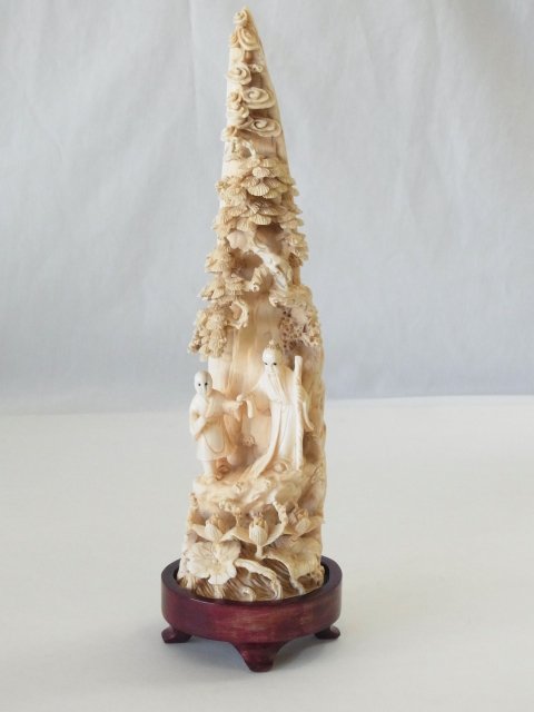 Antique Signed Chinese Carved in the Round Ivory Tusk D: Antique Signed Chinese Carved in the Round Ivory Tusk Depicting Two Buddhist Scholars or Monks in a Mountain Landscape w Lotus Flowers at Base Ornately carved in the round from a substantial end piece