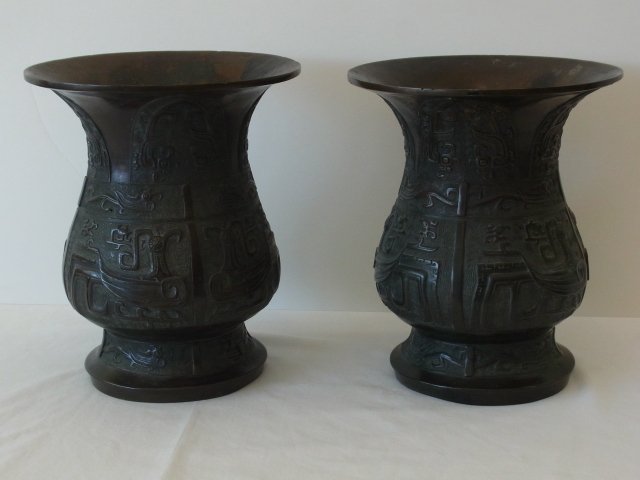 Early Pair Chinese Archaic Bronze Rare Ritual Wine Zun: Early Pair Chinese Archaic Bronze Rare Ritual Wine Zun Vessels Signed with Bird & Dragon Forms Probably Zhou Dynasty Circa 1000 – 200 BC There was evidently some early repair work done to these piec