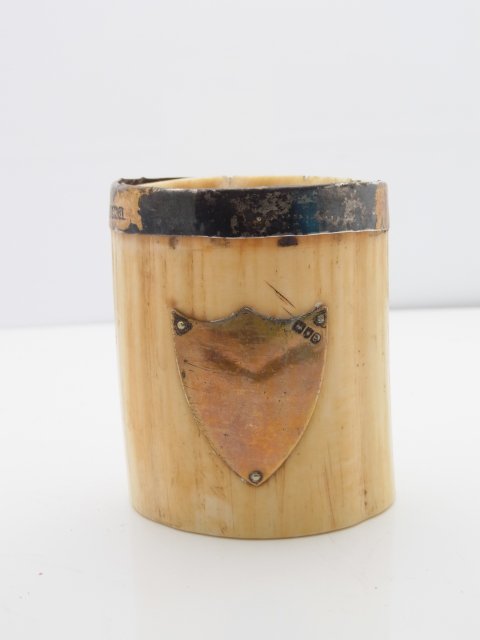 1800s Ivory Tusk Carved Toothpick Holder Cup W&Co Sterl: 1800s Ivory Tusk Carved Toothpick Holder Cup W&Co Sterling Silver Reinforced Rim and Blank Crest Plaque. Gold plated sterling silver. Approximate Dimensions: 2 ¾” tall, 2 ¼ X 2 1/8” Hess Fine A