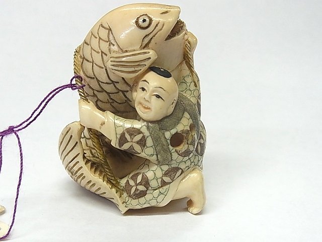 Antique Early Japanese Ivory Polychrome Okimono Netsuke: Antique Early Japanese Ivory Polychrome Okimono Netsuke Folklore Kintaro Boy & Koi Carp Description: This is an early hand-carved and inked Japanese Netsuke, most likely representing the folktale of K