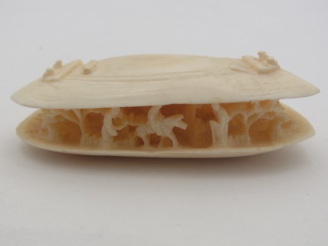 Precision Carved Antique Ivory Okimono Miniature Chines: Precision Carved Antique Ivory Okimono Miniature Chinese Village Scene w Horseback Rider within Clam Shell Motif. Astonishing detail on such a small scale. Tiny work of art with exceptional craftsmans