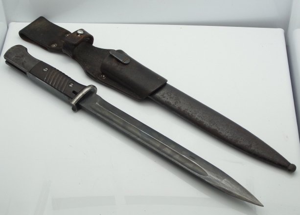 42 CVL Mauser Bayonet Knife with Matching Scabbard and: 42 CVL Mauser Bayonet Knife with Matching Scabbard and Leather Size: 16 1/4” long Hess Fine Auctions Shipping:We offer in house shipping for a handling fee, or you may elect to contact an outside sh