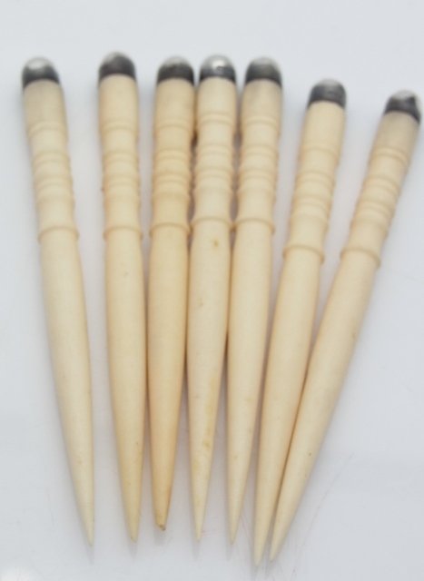 Set of 7 Carved Ivory Toothpicks with Sterling Silver E: Set of 7 Carved Ivory Toothpicks with Sterling Silver Ends Size: 3 1/8” tall6mm diameter, each Hess Fine Auctions Shipping:We offer in house shipping for a handling fee, or you may elect to contact 