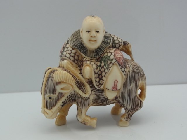 Antique Carved Ivory Netsuke Polychrome Inked Ram with: Antique Carved Ivory Netsuke Polychrome Inked Ram with Man Size: 1 5/8” long, 1” wide, 1 3/4” tall Hess Fine Auctions Shipping:We offer in house shipping for a handling fee, or you may elect to 