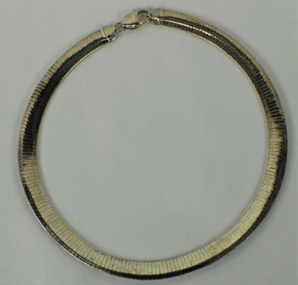 Vintage Sterling Silver Flat Serpentine Necklace: Stamped "925 Italy". Measures approximately 15 1/2 inches long. Weighs approximately 24.8dwt. From the estate of Lou Witt.