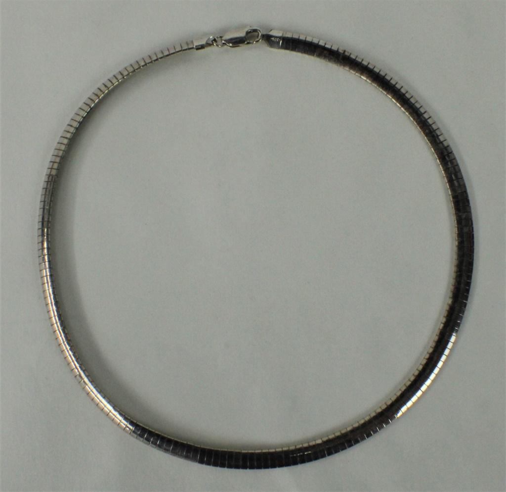 Sterling Silver Serpentine Necklace: Stamped "925 Italy". Approximately 16 inches long. Weighs approximately 17.7dwt. From the estate of Pamela Curry.