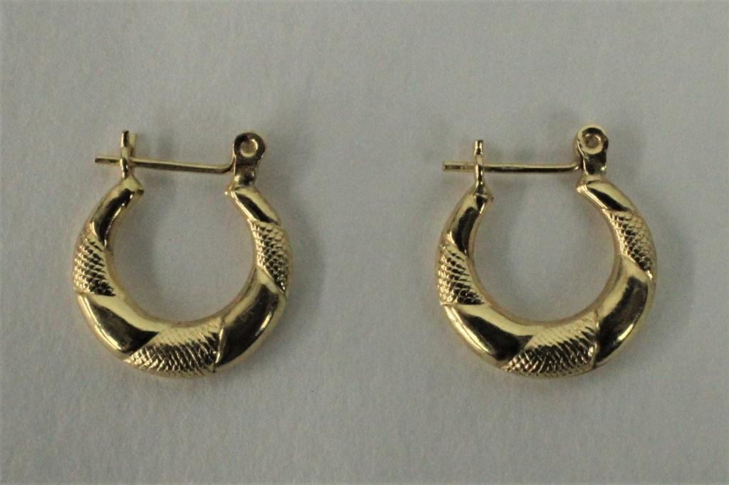14K Yellow Gold Hoop Earrings: Marked "14K". Approximately 1/2 inch diameter. Weighs approximately .5dwt. From the estate of Lou Witt.
