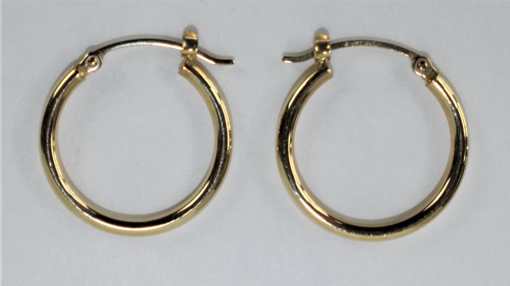 14k Yellow Gold Hoop Earrings: Stamped "14K". Approximately 1 7/8 inches diameter. Weighs approximately 1.3dwt. From the estate of Pamela Curry.