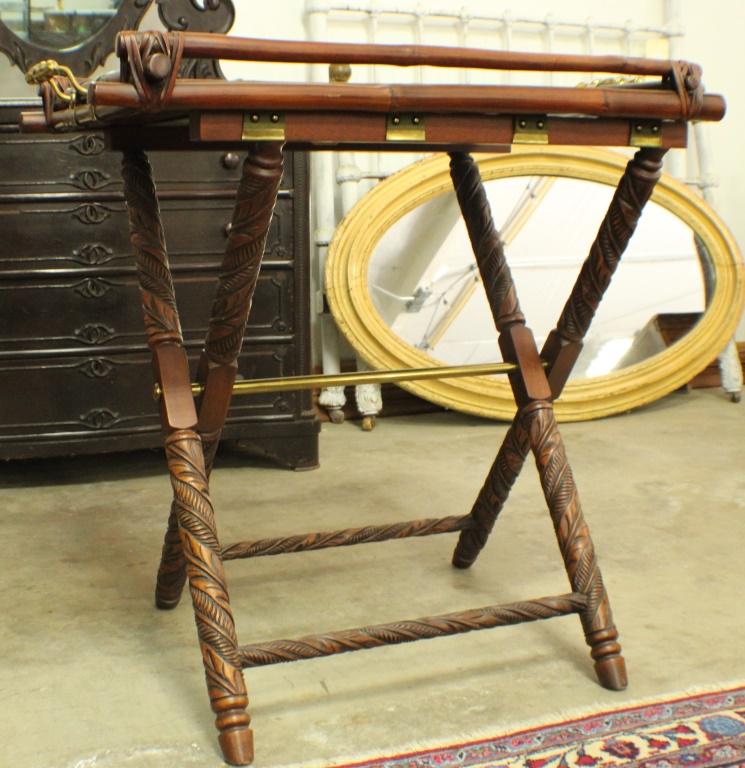 Ralph Lauren "Sussex" Butlers Tray on Stand: A "Sussex" Butler's Tray Table, with a rattan and carved mahogany "bamboo" tray with turned gilt metal handles, atop a folding X-form base with rounded legs and stretchers decorated with carved banana