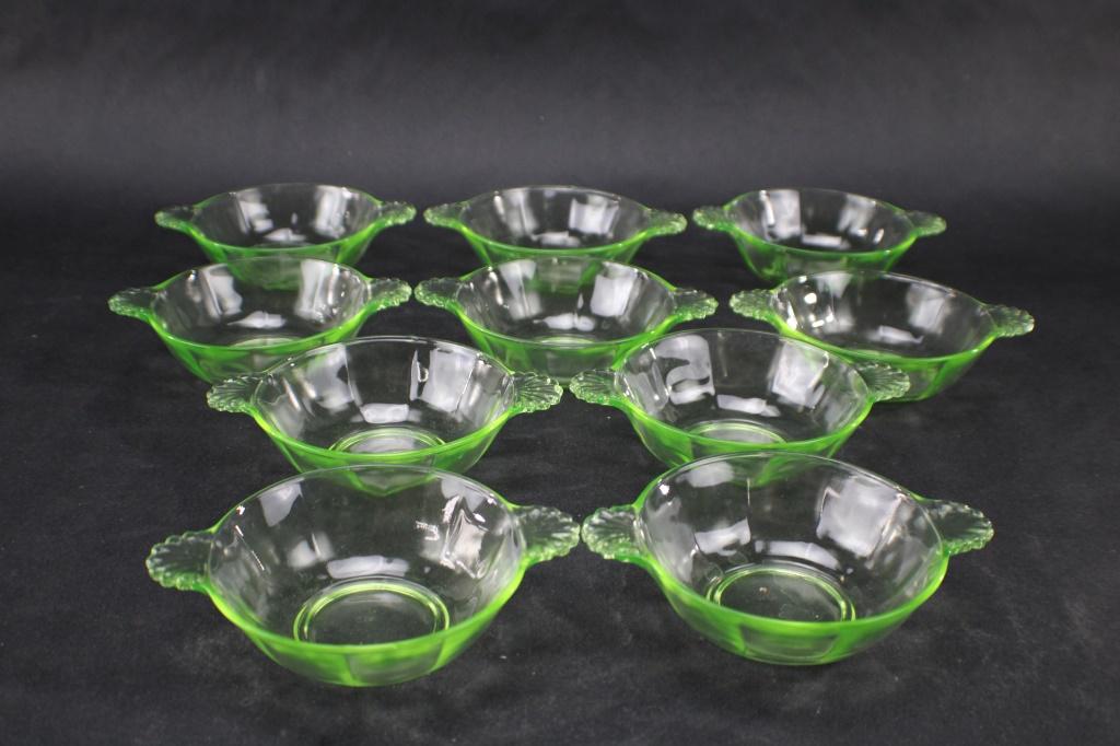 10 VINTAGE GREEN URANIUM GLASS BERRY BOWLS: 10 VINTAGE GREEN URANIUM GLASS BERRY BOWLS. Measures approximately 5 3/4 Inches Handle to Handle x 4 1/4 Diameter x 11/2 Inches Tall. Fluorescence under Blacklight. No visible chips or cracks. From th