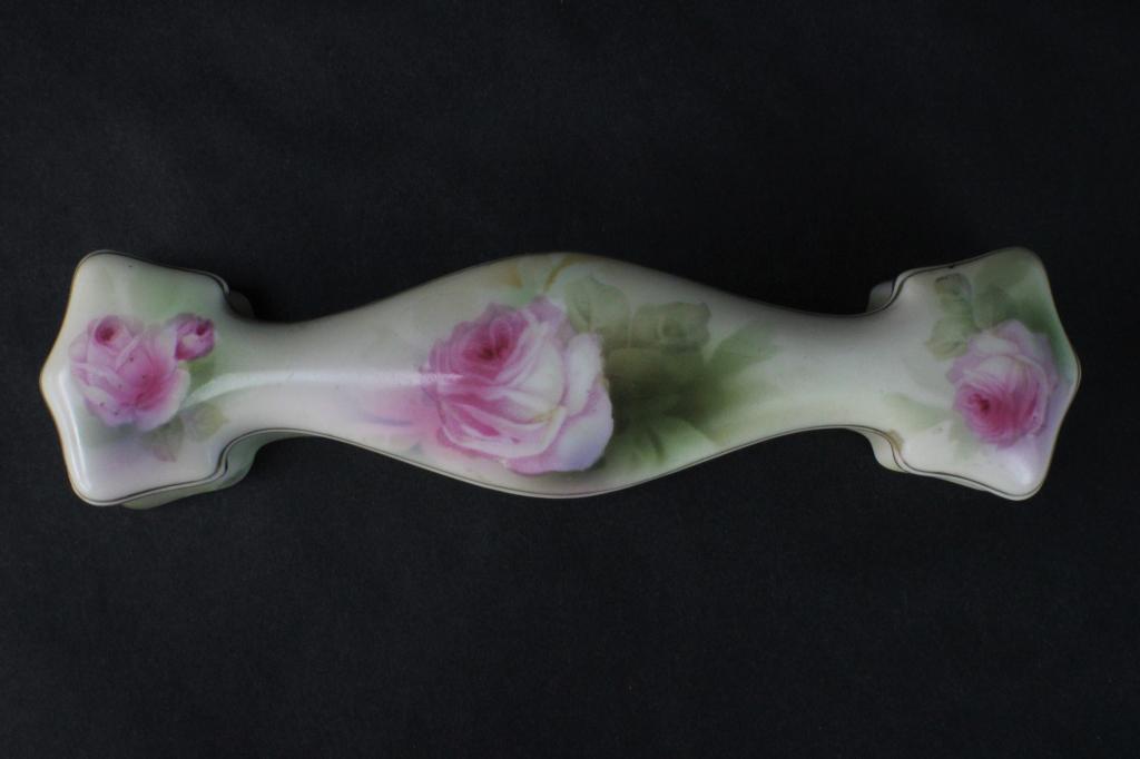 RS Germany Porcelain Pink Rose on Green Bone Dish: Measures approximately 1.5 inches tall x 2 1/4 inches wide x 8 1/2 inches long. Design features three roses against a background of varying green tones. Gold line work defines the edges of the lid. Bo