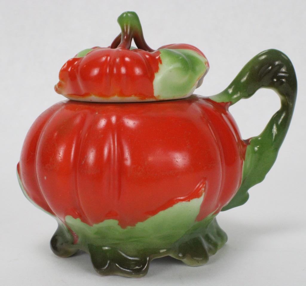 Royal Bayreuth Porcelain Tomato Mustard Dish: Measures approximately 3 1/4 inches tall, 4 inches wide, 1.5 inches in diameter. This tomato mold piece utilizes rich red and green hues. The bottom of the piece includes a maker's mark, reading, "Roy