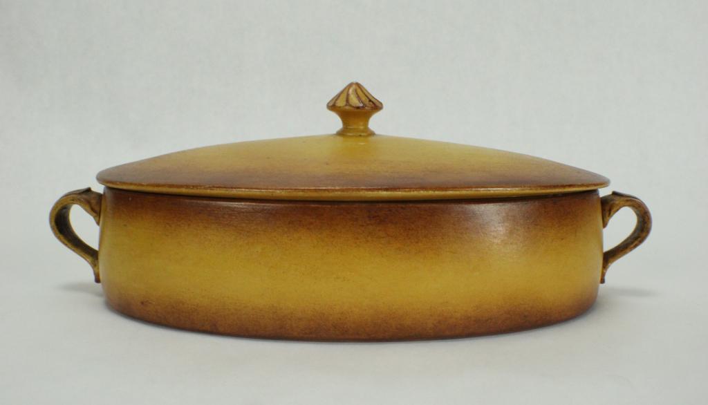 C.P. & CIE Porcelain Covered Casserole Dish: Marked on bottom "C.P. & CIE France". Measures approximately 12 inches long (handle to handle) x 6 1/2 inches wide x 4 1/2 inches tall. No visible chips or cracks. From the collection of Laura Gallagh