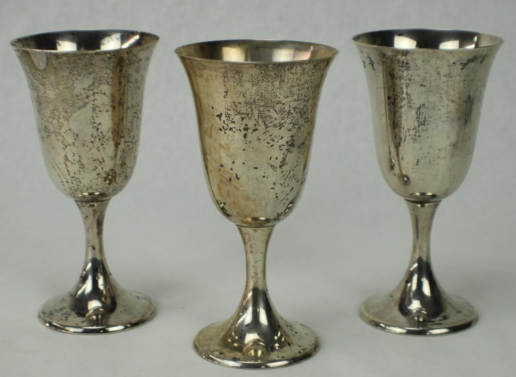 Set of 3 Gorham Sterling Silver Goblets: Each are stamped with the hallmark for Gorham Mfg Co. Early 20th Century (circa 1920's) and "Gorham Sterling 892". Stands approximately 6 1/2 inches tall and 3 1/4 inches diameter at rim. Each weighs 