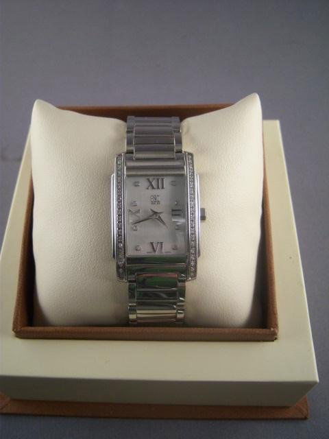 Esq Swiss 07101256 Women's Kingston Mother of Peal: A glittering minimalist look you'll love. This ESQ by Movado watch features a stainless steel bracelet and case lined with sparkling diamond accents. White Mother of Pearl dial with Roman numerals and