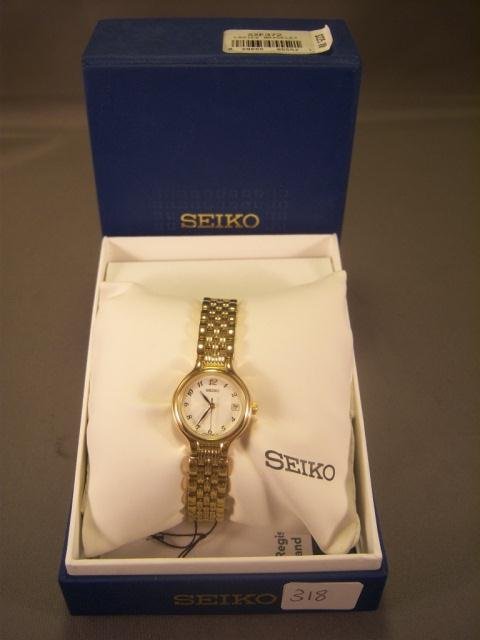 Seiko SXE372 Gold Tone Women Watch: Classically urbane, the Seiko SXE372 gold-tone stainless steel women's watch offers a no-nonsense design that's well suited to both sporty and business ensembles. It has a perfectly round watch case t