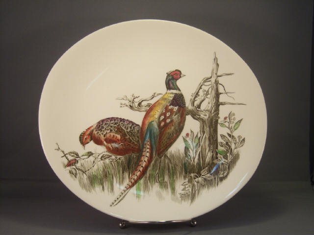 Vintage China Game Bird Serving Platter: A piece of the Game Bird series of semi-porcelain china made by Johnson Brothers of England. The Pheasant serving platter, 11 1/4 in length. Excellent condition."