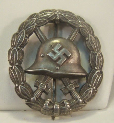 German WWII Silver Condor Legion Wound Badge: German WWII Silver Condor Legion Wound Badge. This is the cut out version. Pin back. Stamped nickel construction