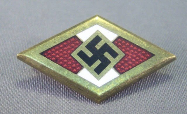 German WWII Golden Hitler Youth HJ Honor Badge: German World War II Golden Hitler Youth HJ Honor Badge. Maker marked 'RZM M1/70 Ges Gesch 9540'. Pin back. Brass and enamel construction