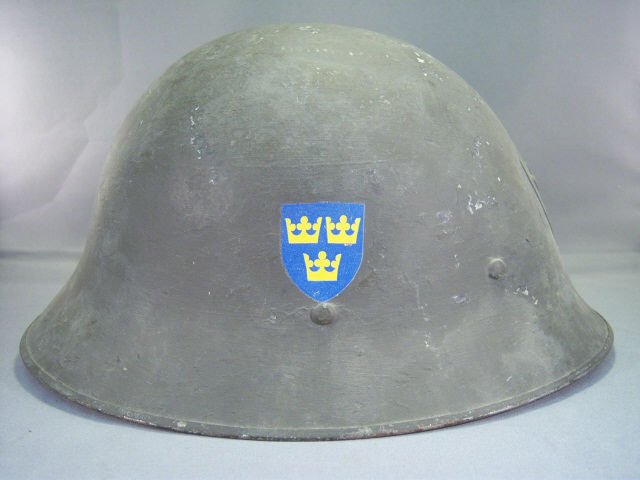 Swedish WWII Double Decal Steel Helmet: Swedish WWII Double Decal Steel Helmet - Leather Chinstrap and Liner Intact - Has Flaking in Paint - Three Yellow Crown on Blue Shield Decal Either Side - Good Condition