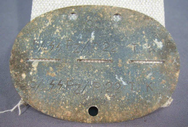 German WWII Waffen SS Panzer Regiment Dog Tags: German World War II Waffen SS Panzer Regiment Soldier's Dog Tag. Stamped '5/SSPZ/R22 T K 3007'. Zinc construction
