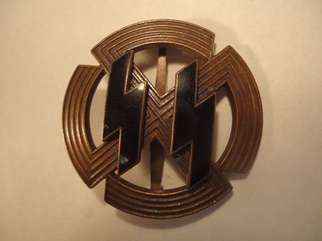 German World War II Bronze Dutch SS Sports Badge: German World War II Bronze Dutch SS Sports Badge. Has a wide vertical pin back. Maker marked 'Richard Sieper & Sohn - Ludenscheid RZM M1/25'. Three piece construction with a pair of black enameled run