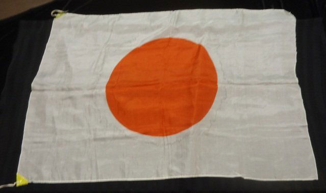 Japanese World War II Silk Meat Ball Prayer Flag: Japanese World War II Silk Meat Ball Prayer Flag. Measures 25 1/2 wide by 36 7/8" tall. Has a pair of reinforcements in two corners with ties. Silk construction"