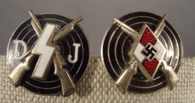 WWII Deutsches Youth & Hitler Youth Shooting Award: German World War II Deutsches Youth DJ & Hitler Youth HJ Shooting Awards. Both have a thin horizontal pin back. Maker marked 'RZM M1/123' & ' RZM M1/17'. Nickel and enamel construction