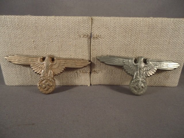 2-German WWII Waffen SS Officers Visor Cap Eagles: 2-German World War II Waffen SS Officers Visor Cap Eagles. There is only one prong on the back of each one. Both are maker marked 'RZM M1/52'. Stamped silver plated nickel construction