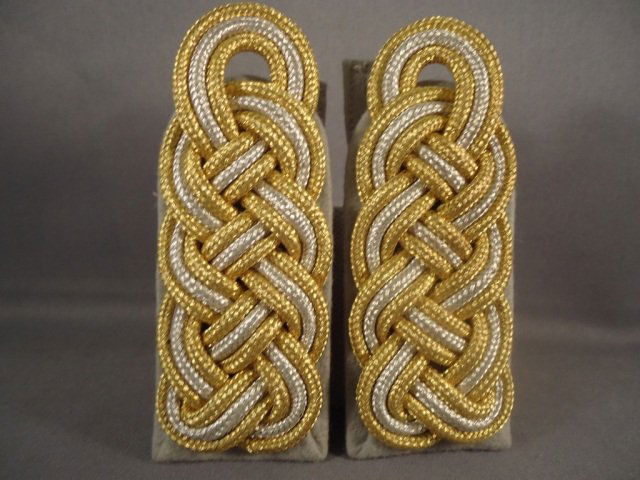 2 German WW II Waffen SS General Shoulder Boards: Pair German World War II Waffen SS General Shoulder Boards. They measure 1 13/16 wide by 4 1/4" long. Silver & gold bullion wire construction mounted on a grey wool backing. These are the slip on vari