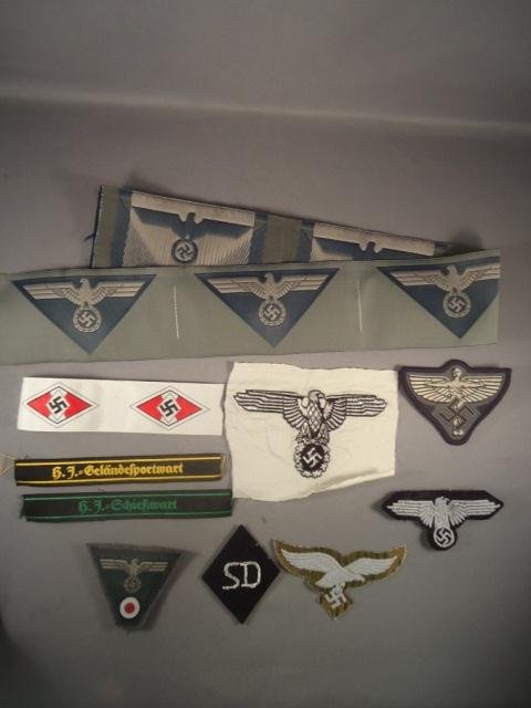 Group of German World War II Cloth Insignia: Group of German World War II Cloth Insignia Lot. Includes Army; SS; Hitler Youth HJ; Luftwaffe; NSFK; SD