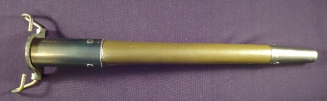 US World War I Army Combat Trench Knife Scabbard: US World War I Army Combat Trench Knife Scabbard. Measures 10 1/2" long. Has a metal throat and tip with a green painted leather scabbard. This is for the triangular bladed knuckle knife with a wood h