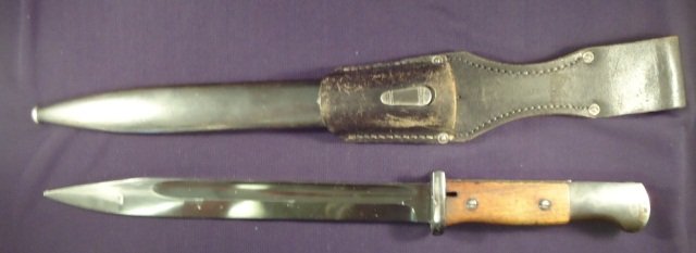 German WWII Police Mauser K-98 Rifle Bayonet & Sca: German World War II Police Mauser K-98 Combat Rifle Bayonet & Scabbard. The blued steel blade is maker marked 'E u F Horster 40'. It has a pair of wood handles with a police emblem mounted on the fron