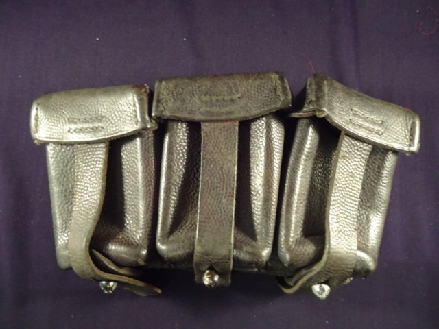 German WWII Waffen SS Mauser K-98 Ammunition Pouch: German World War II Waffen SS Mauser K-98 Ammunition Pouch. The reverse is marked with a pair of SS lightning bolt runics. It is also dated '1939'. The pouches are black leather construction