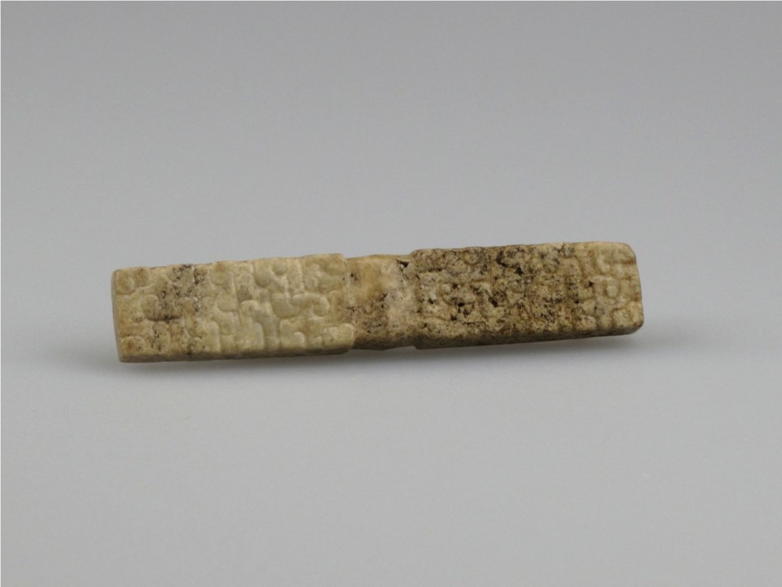 A Chinese Topaz Lezi, Warring States: Of flat and rectangular form with plain and pristine design on the exterior. L: 8 cm