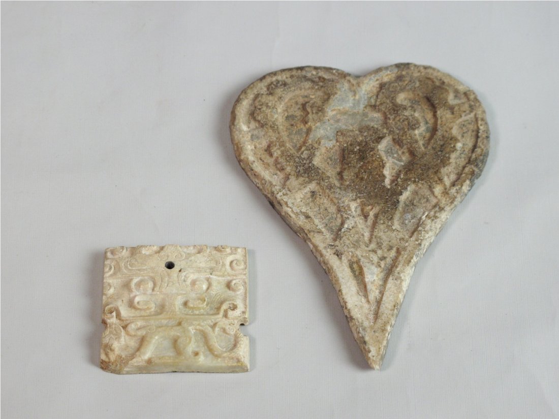 Carved Jade Ornament with Beast Mask Design, Han: A Carved Jade Ornament with Beast Mask Design, Han Dynasty. Together with a heart shaped tablet. H: 3.3 cm & H: 9cm