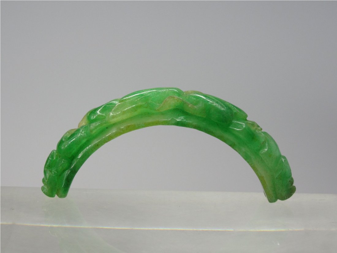 A Chinese Emerald Green Jadeite Bangle Ornament: L: 6.8 cm