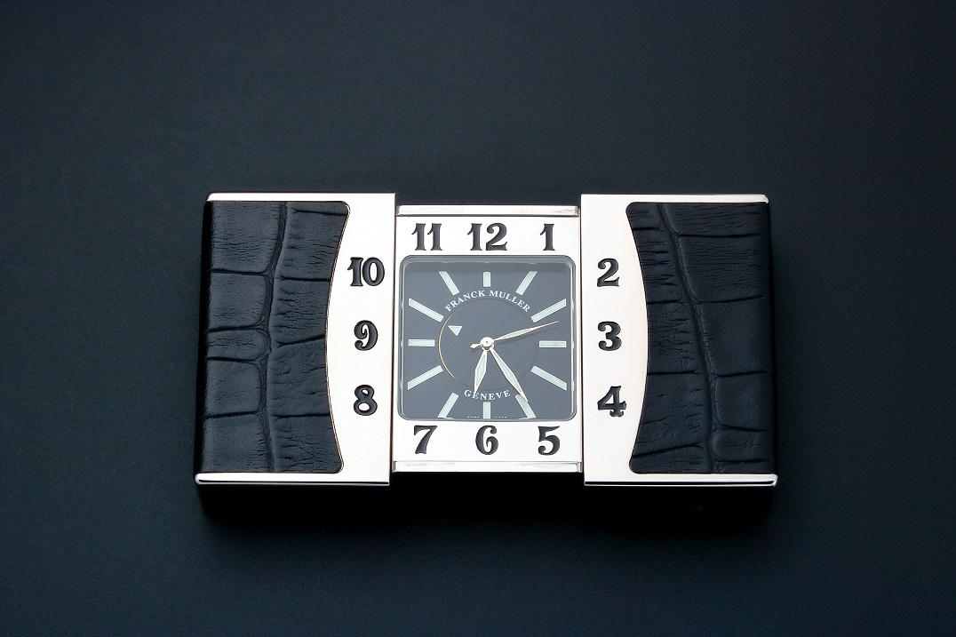Franck Muller Ermeto Travel Alarm Desk Clock: Very fine and rare stainless steel Franck Muller travel Ermeto alarm desk clock. Black Franck Muller Geneve dial with luminescent hands and hour markers. Engraved bezel. Case back engraved with