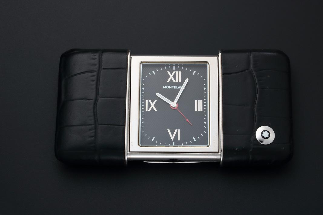 Montblanc Ermeto Alarm Travel Desk Clock: Stainless steel Montblanc Ermeto travel alarm desk clock. Black Montblanc dial with Roman hour markers and luminescent hands. Swiss made, quartz movement with alarm function. Case back engraved 