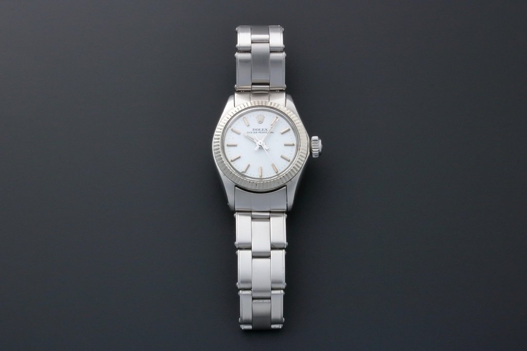 Rolex Oyster Perpetual Watch 6619 Vintage Ladies: Vintage ladies stainless steel Rolex Oyster Perpetual wristwatch, ref #6619. Circa 1968. White Rolex Â“T Swiss TÂ” dial with applied bar hour markers. White gold fluted bezel. Swiss made, self w
