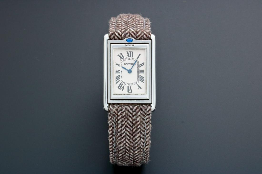 Cartier Tank Basculante Mechanical 2390 Watch: Brand: Cartier Model: Tank Cartier Basculante Reference: #2390 Approximate Diameter: 25mm x 31mm Dial Color: Silver guilloche with the Cartier secret signature at the 7 o'clock