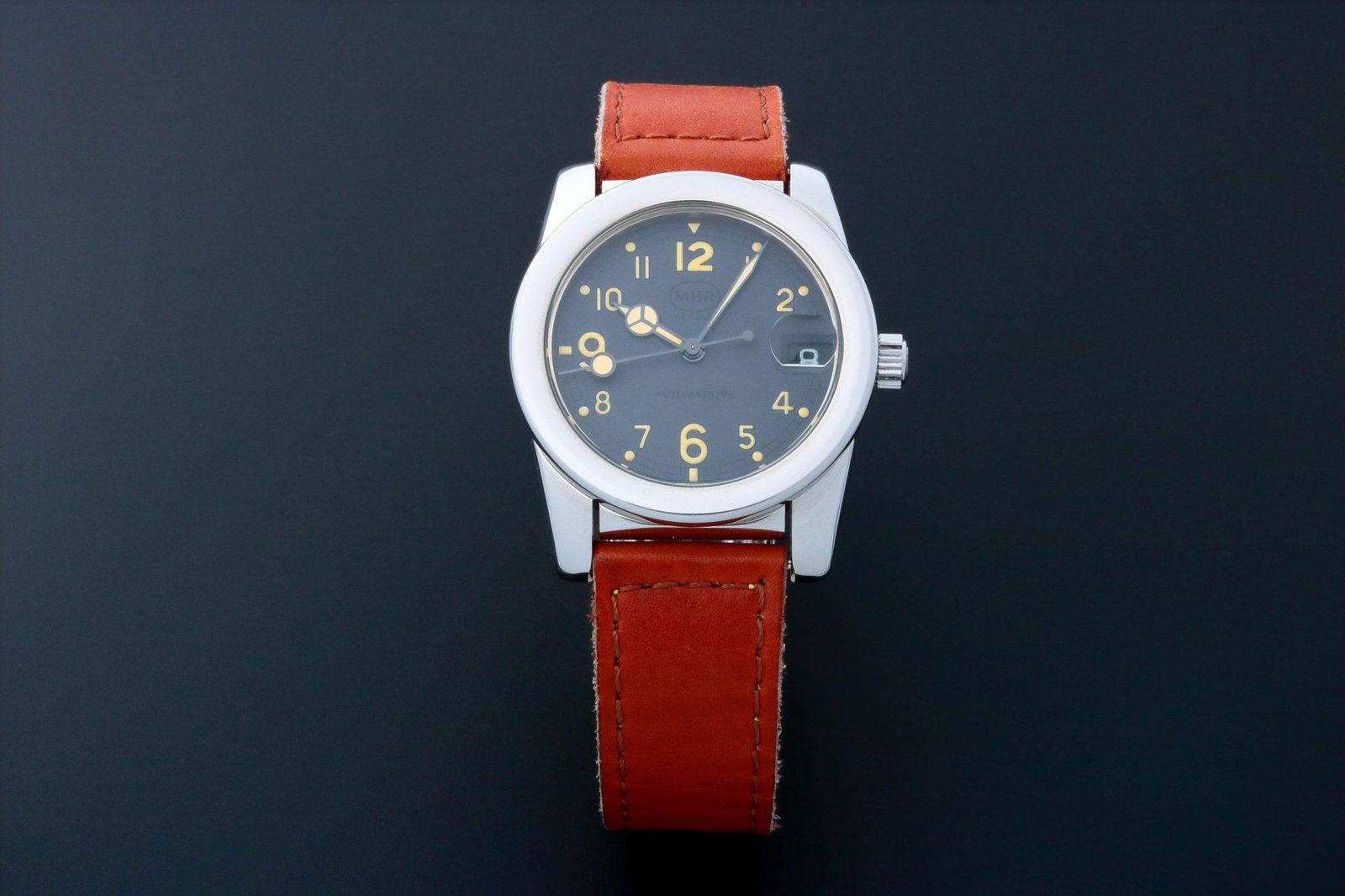 Rare Men's Mahara MHR Grey Date Watch Vintage: Rare men's stainless steel MHR wristwatch with date. Grey MHR Geneve dial with Arabic hour markers and "Mercedes" style hands. Quick set date change. MHR screw down crown. Swiss made, self win