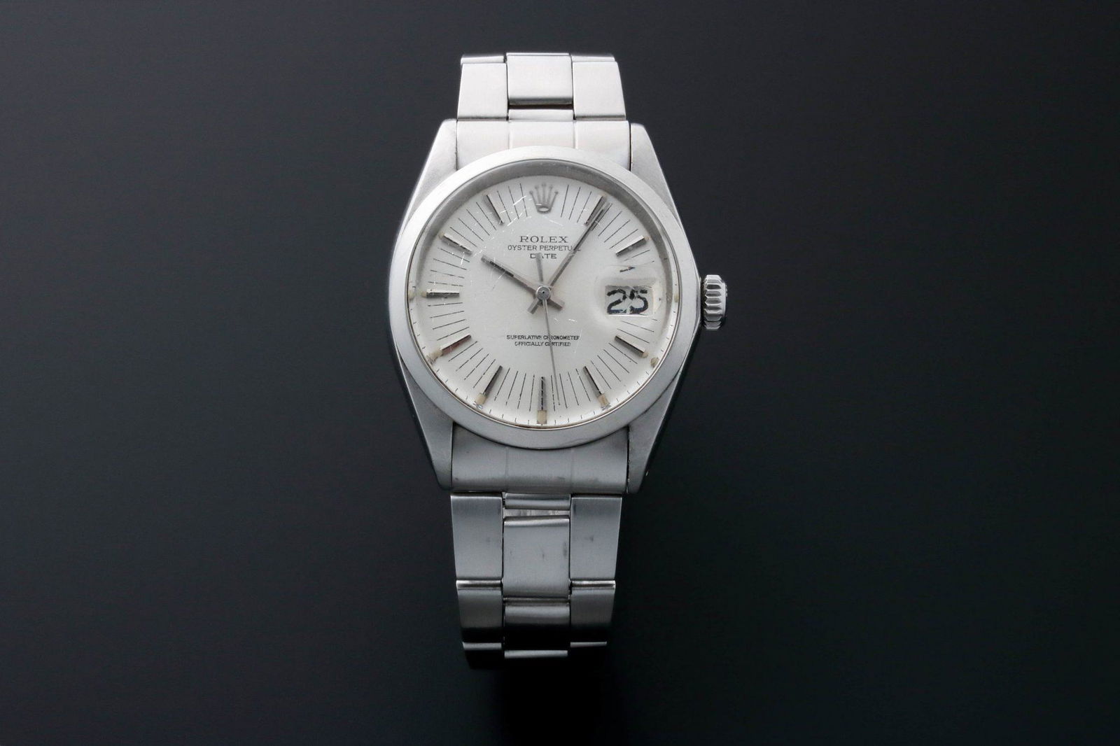 Rolex Oyster Perpetual Date 1500 Rare Long Minutes: Vintage gents stainless steel Rolex Oyster Perpetual Date wristwatch, ref #1500. Circa 1972. Silver Rolex "T Swiss Made T" dial with applied bar hour markers and elongated minute markers. Stainl