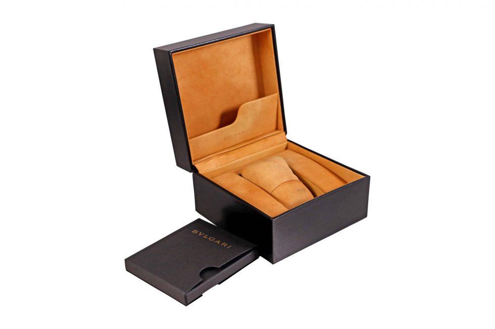 Bvlgari Watch Box With Bulgari Outer Box: Brand: Bvlgari Dimensions Approximate: 5.25 x 5.25 x 3.5 inches Condition: Has areas of light discoloration, wear, and scuffing throughout due to storage and age. Overall condition is good.