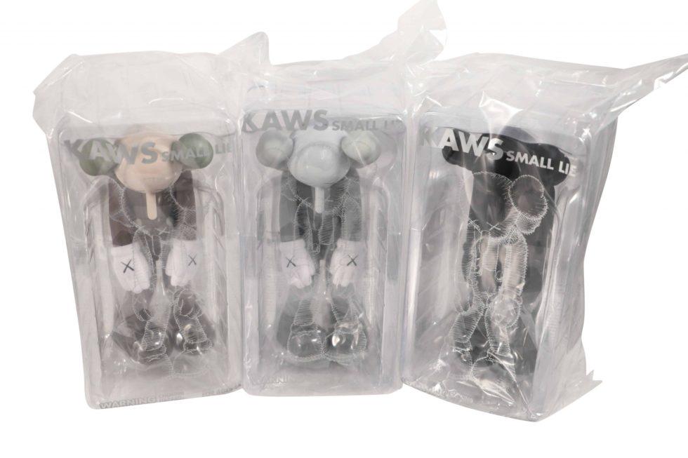 KAWS Small Lie Vinyl 3 Figure Set Brown, Grey, Black: Artist: KAWS Title: Small Lie Set in Brown, Grey, and Black Medium: Vinyl Approximate Dimensions: 11in Edition: 2017 Provenance: Private collection Condition Report: Never
