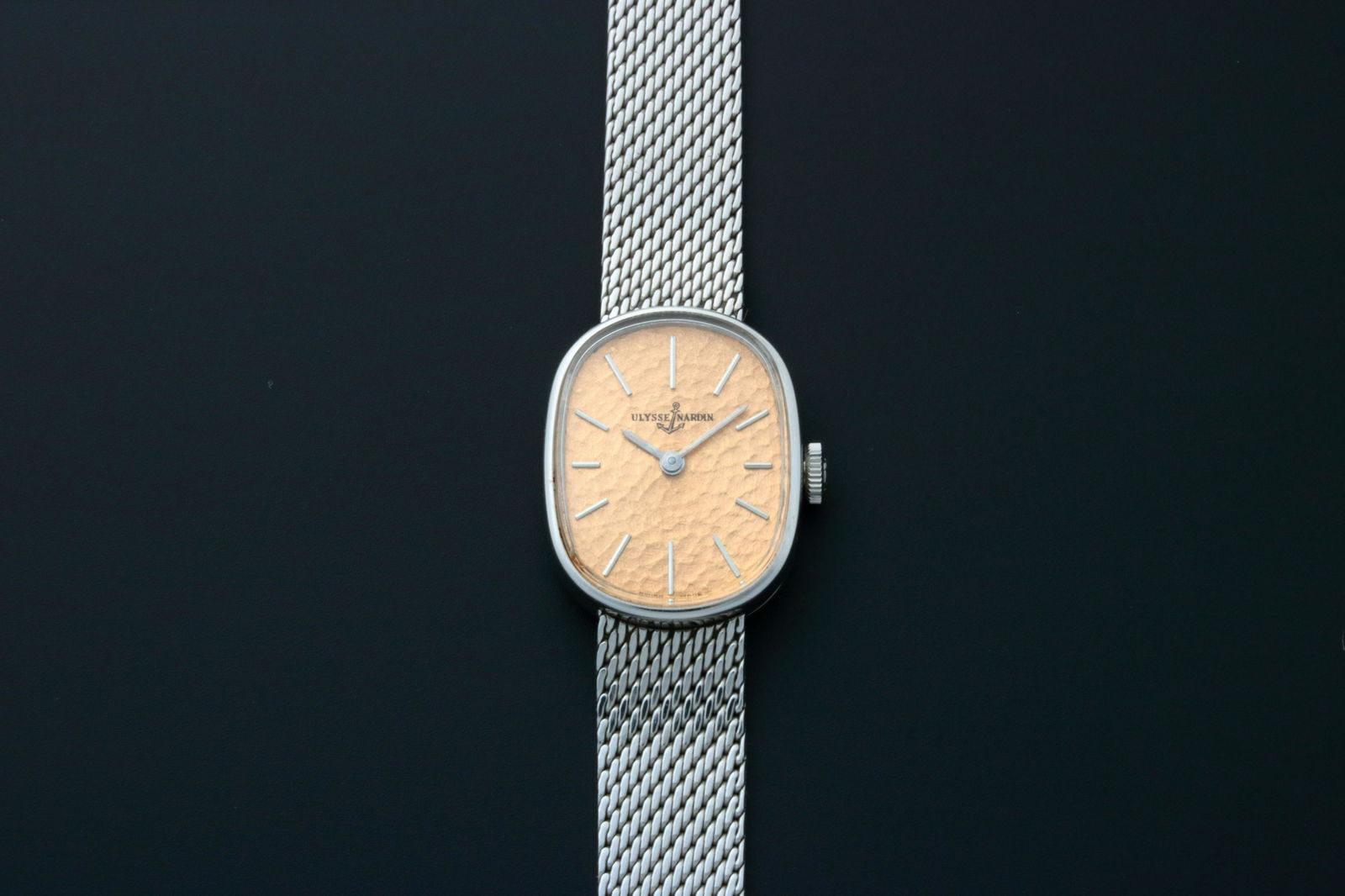 Ladies Ulysse Nardin Cocktail Watch Salmon Dial with: Brand: Ulysse NardinDiameter: 19mmDial Color: Copper / salmonCase Material: Stainless steelBezel Material: Stainless steelCase Back: SolidMovement: Mechanical manual windFunctions: Hours, minutesBand: