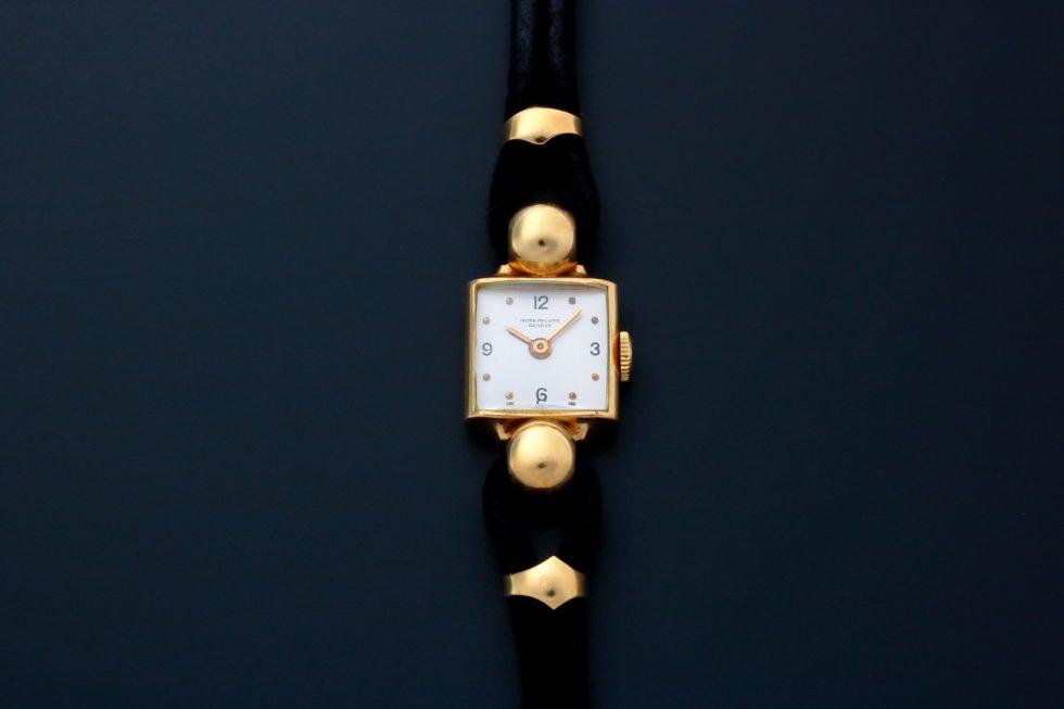 Patek Philippe 18K Yellow Gold Fancy Lugs Cocktail: Brand: Patek Philippe Diameter: 15mm x 15mm, 30mm from top to bottom lugs Dial Color: Silver Case Material: 18k Yellow gold Bezel Material: 18k Y