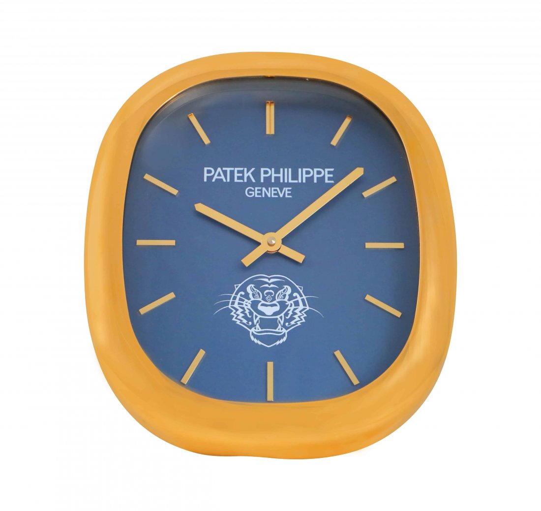 Patek Philippe Ellipse Logo Dealer Wall Clock Rare: Brand: Patek PhilippeModel: Ellipse Wall Clock With LogoApproximate Dimensions: 50cm x 43cmDial Color: BlueMaterial: Gilt brassMovement: Quartz, batteries not included.Functions: Hours, minutesConditi